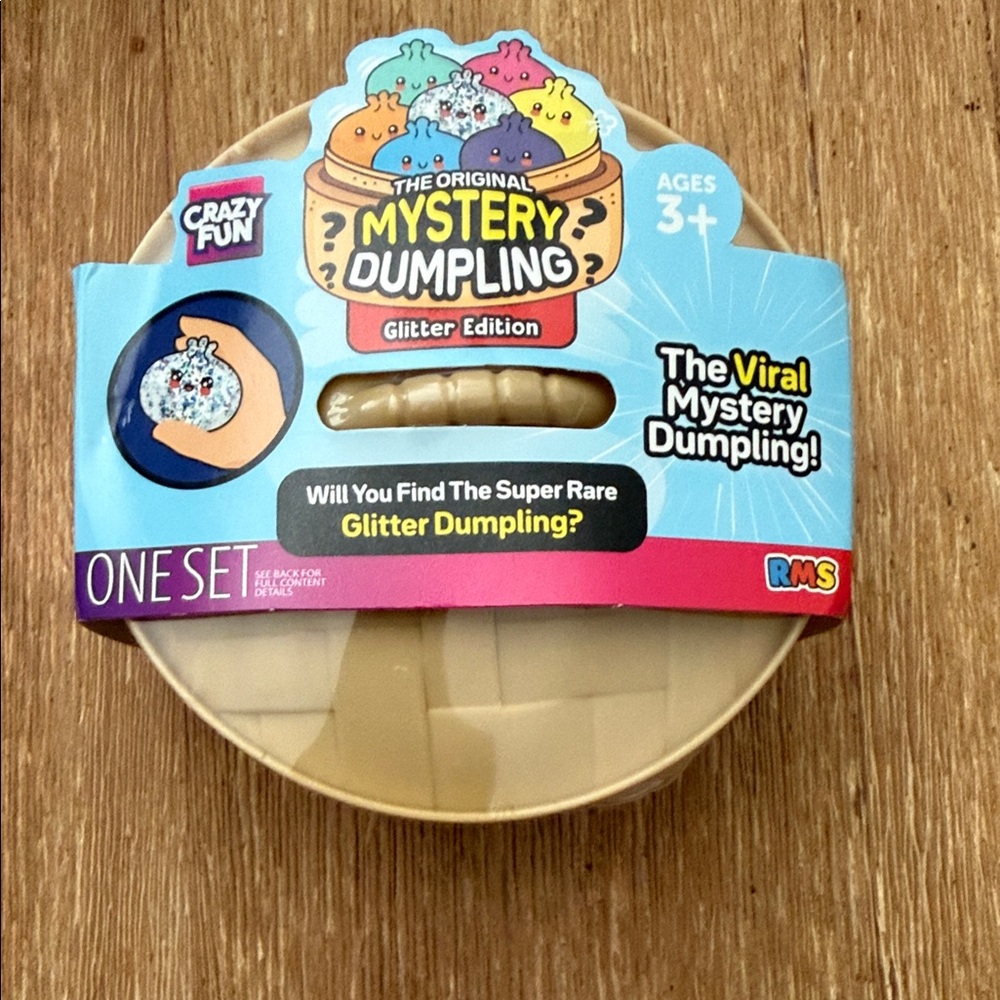 The viral Original RMS Mystery Dumpling Glitter Edition - Blue & Gold Packaging